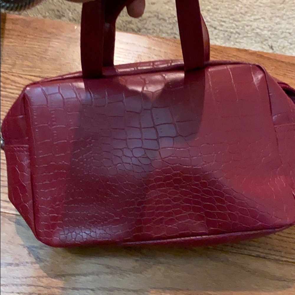 Small red crocodile skin bag